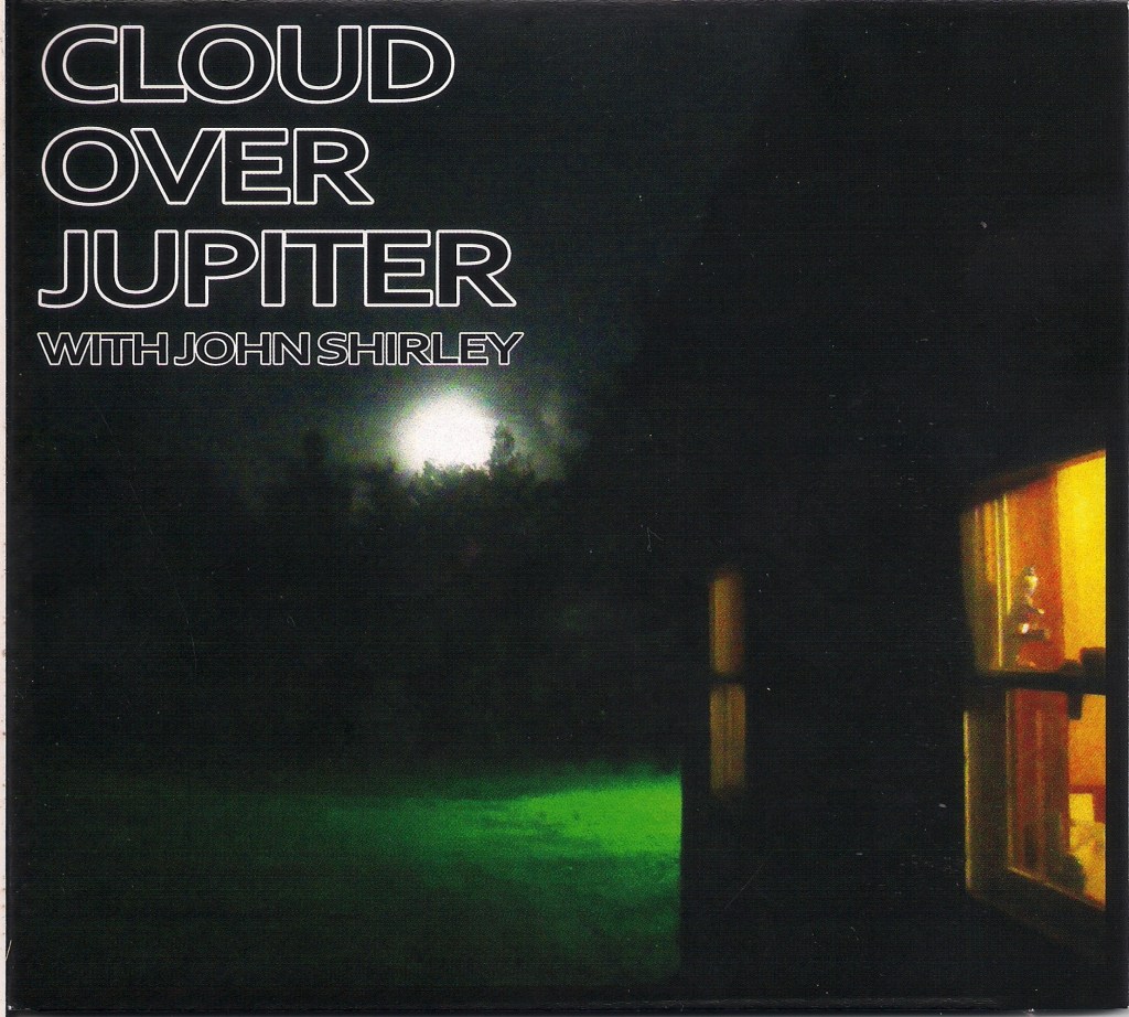 album cover showing dark night, side of house with one window lit from inside, bright moon rising over trees beyond green lawn